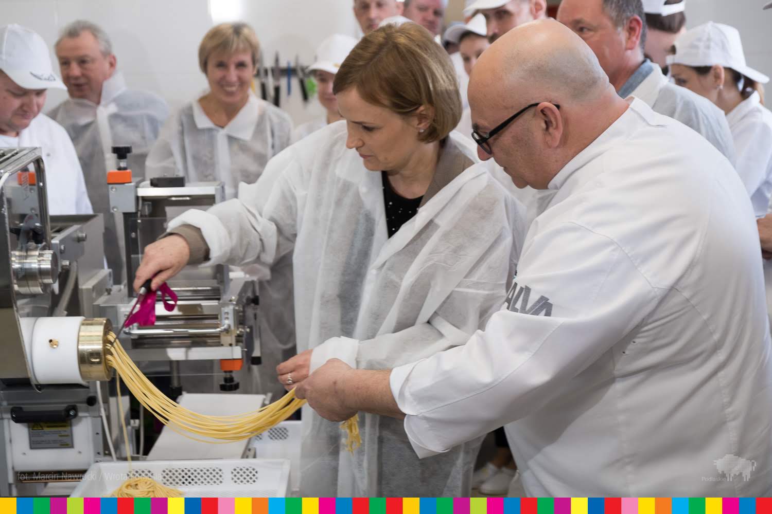 Director of the ESF Department in Marshal's Office tries the machine that produces pasta