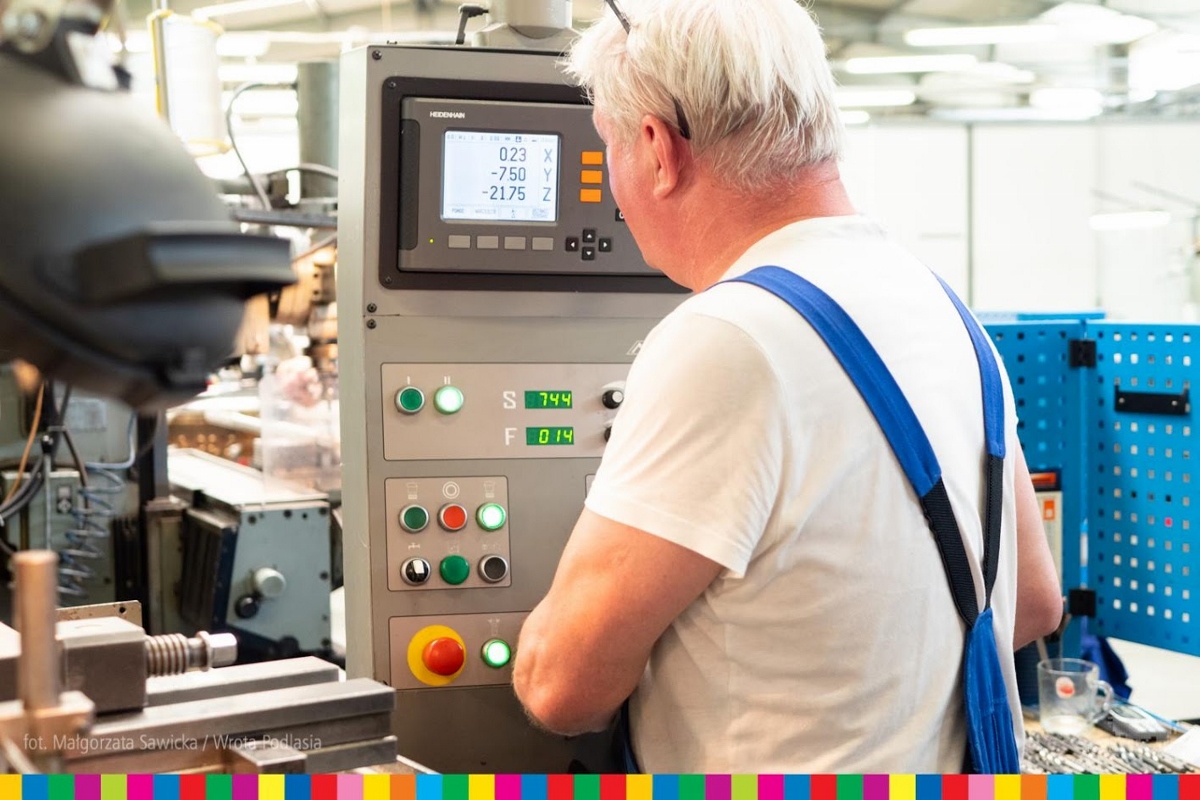 Worker operates a machine