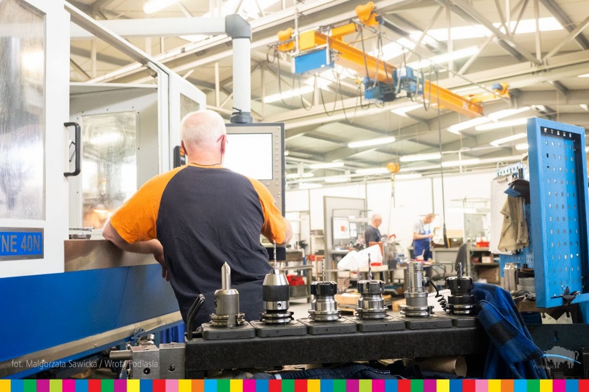 Worker operates a machine